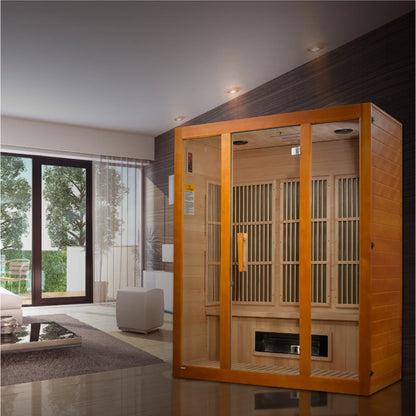 Image of a Maxxus Bellevue 3 Person Far Infrared Sauna in a modern living room setting, featuring large windows and contemporary decor.