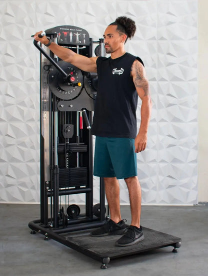Man performing a standing chest flight exercise on a black Muscle-Flight Trainer machine with weight stack and adjustment dial.