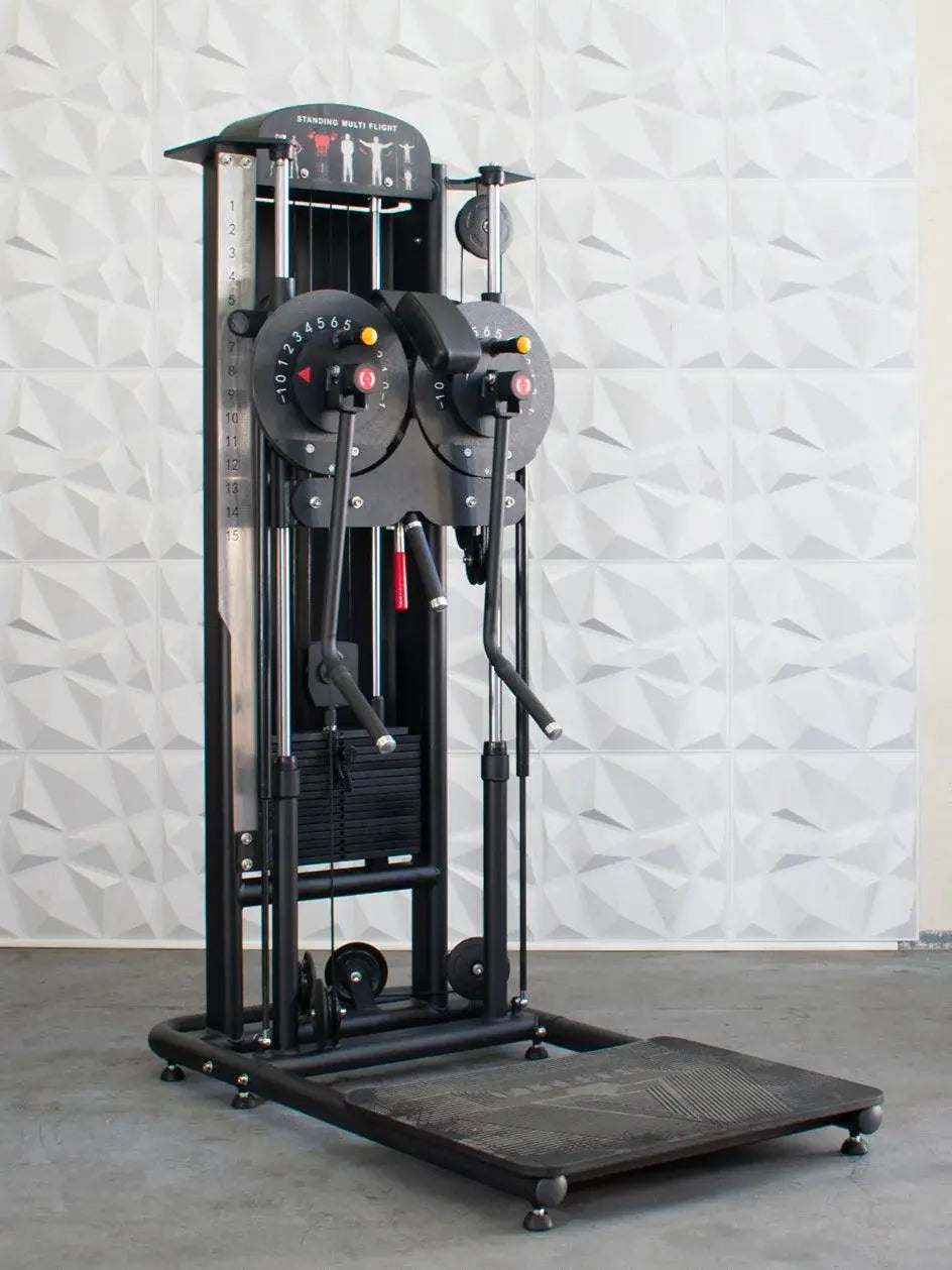 Black standing multi-flight machine with dual rotating weight selectors, numbered 0-15 on each side, cable pulley system, and footplate. Instructional diagrams for standing exercises visible at the top.