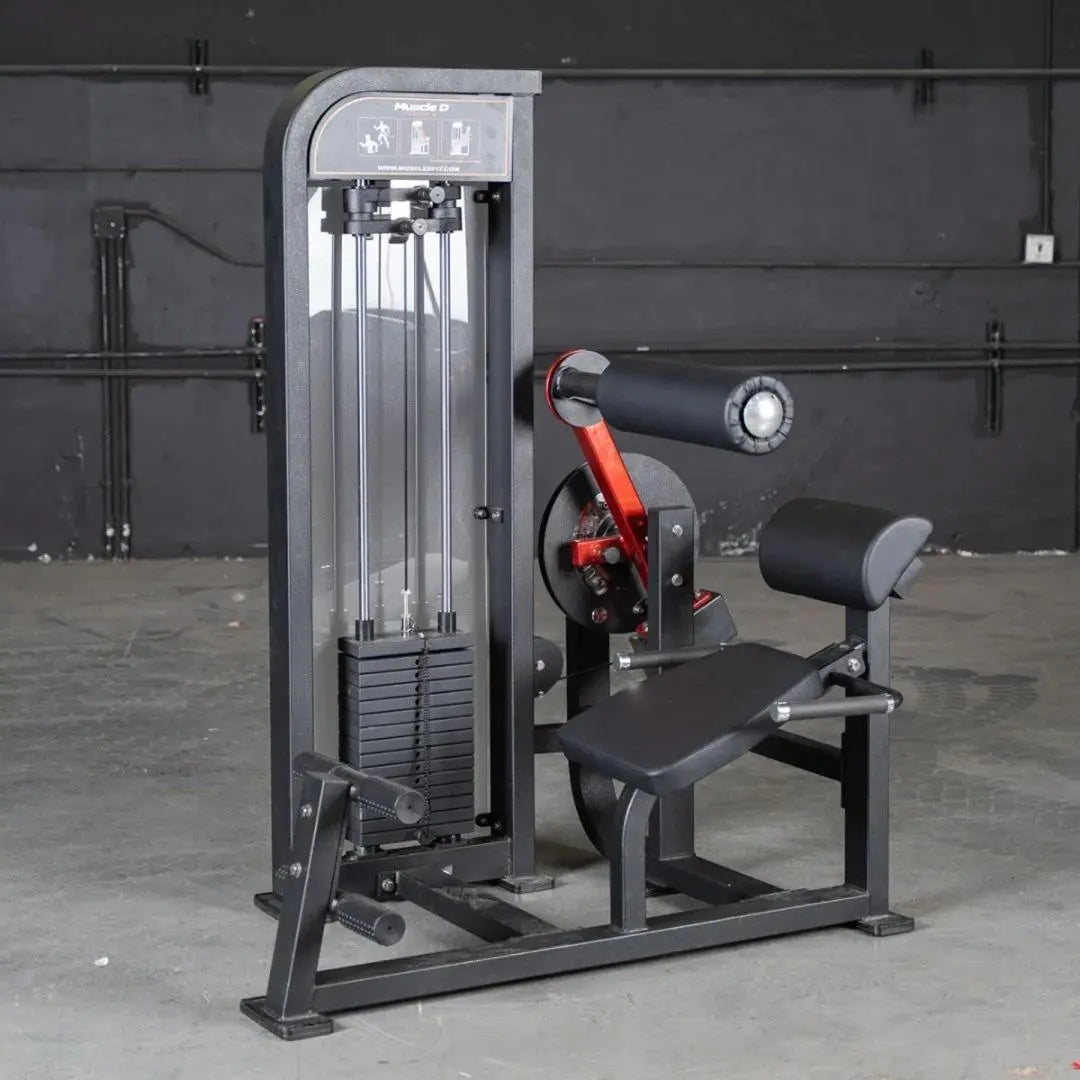 Commercial selectorized back and ab combo machine with gray and black frame, red accents, weight stack on left side, and padded seat and back support on right side in a gym setting.