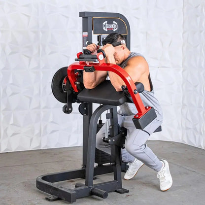 Man performing a biceps and triceps exercise on a red and black selectorized cable machine with black seat and foot platform.