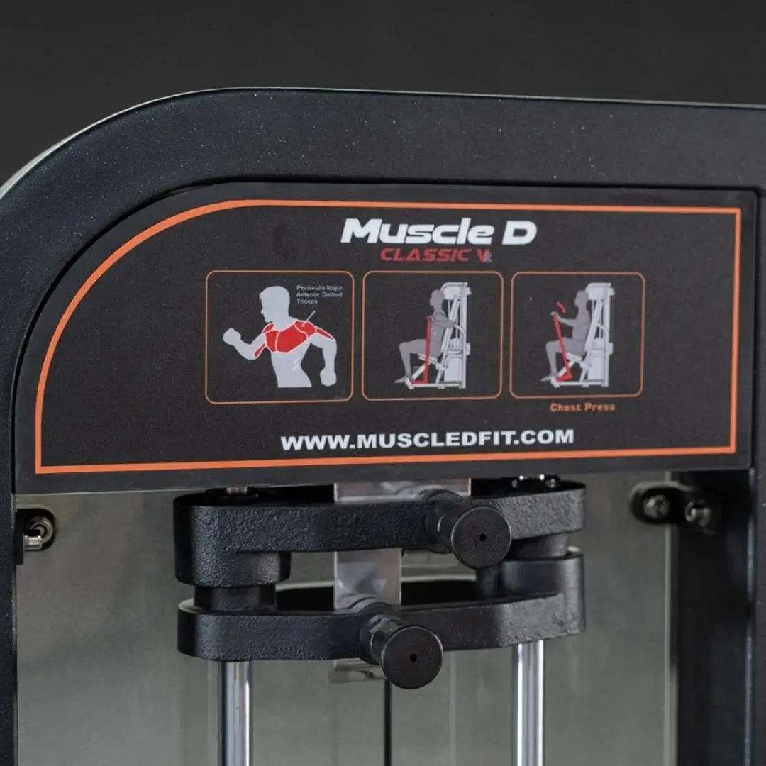 Muscle D Fitness Classic V2 selectorized chest press machine with black frame and orange accent trim, featuring instruction diagrams showing pectoralis major muscle engagement and exercise movements.