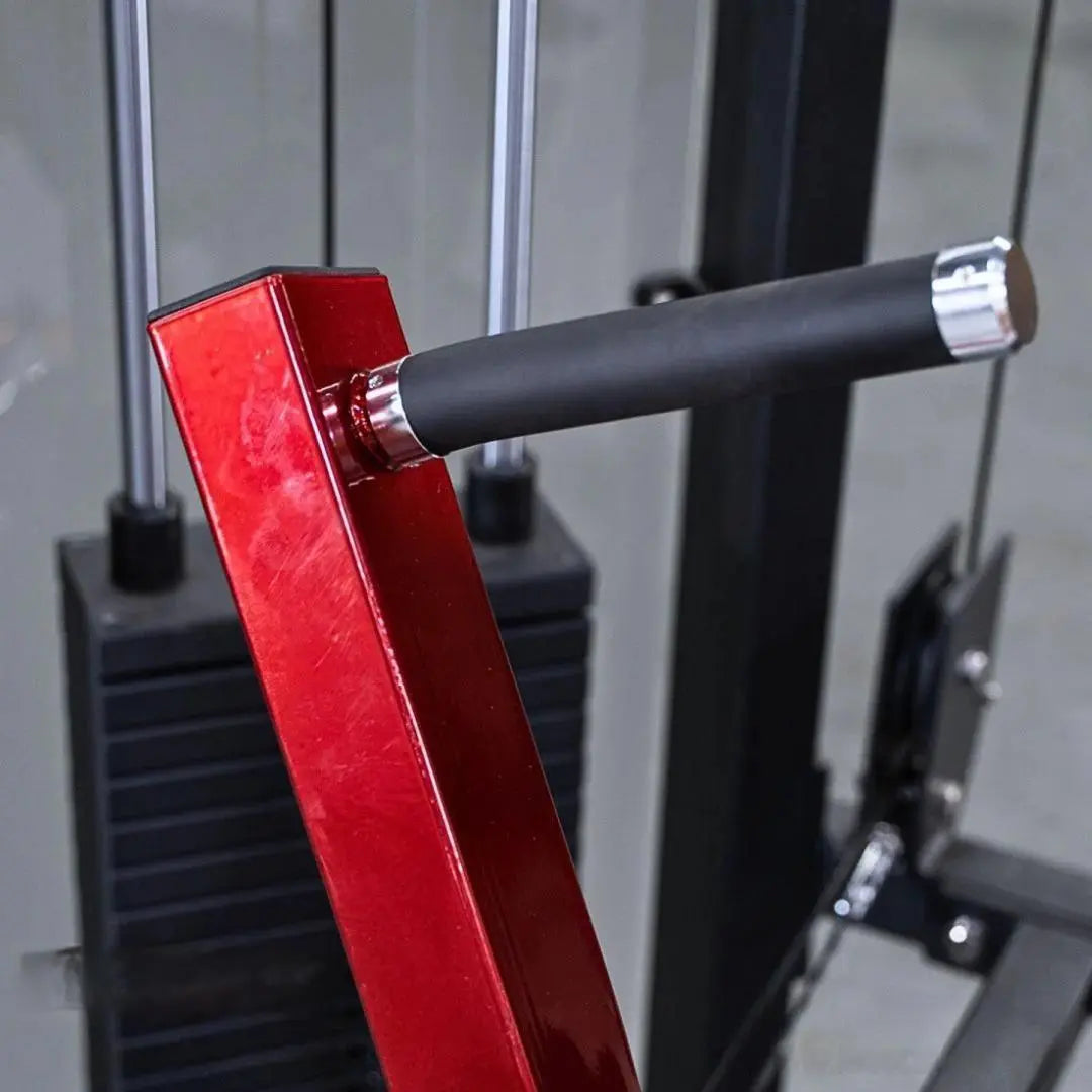 Close-up of a red selectorized chest press machine with a black grip handle and chrome accents, part of a commercial gym equipment frame.
