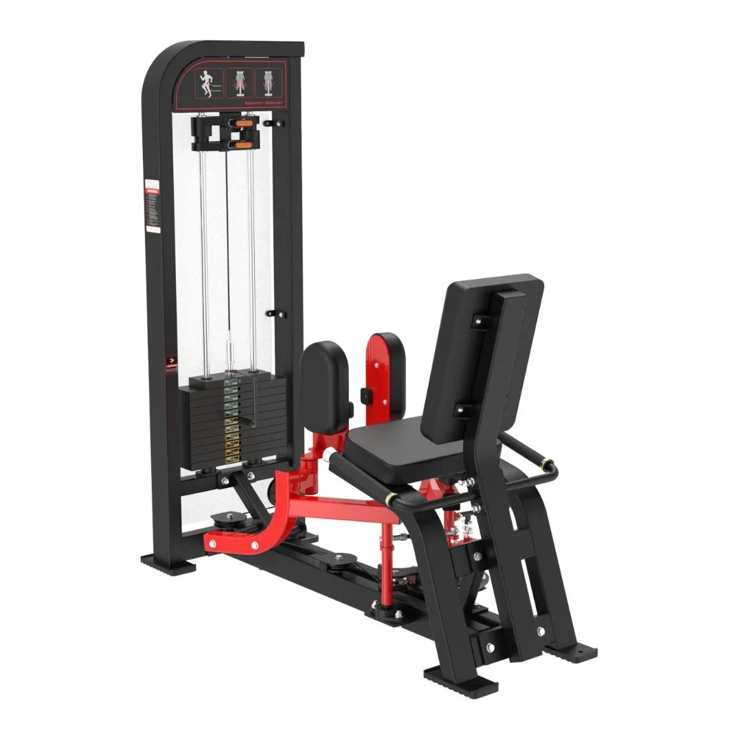 Black and red selectorized inner and outer thigh machine with stacked weight plates, padded seat, and instruction graphics on the upper console.