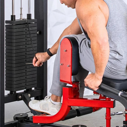 Man performing inner and outer thigh exercise on a red and black selectorized thigh combo machine with weight stack visible in the background.