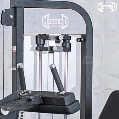 Black and white commercial leg extension and seated leg curl combo machine with dual black padded foot bars, metal frame, and control lever on the side.