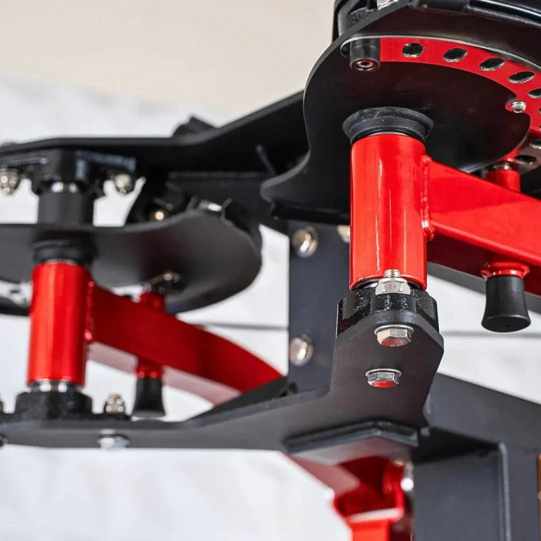 Close-up of red and black selectorized pec and rear delt combo machine showing adjustment knobs, metal frame, and weight stack selector holes.