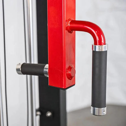 Red and black selectorized pec and rear deltoid combo machine with curved red handles and chrome accents on vertical frame.