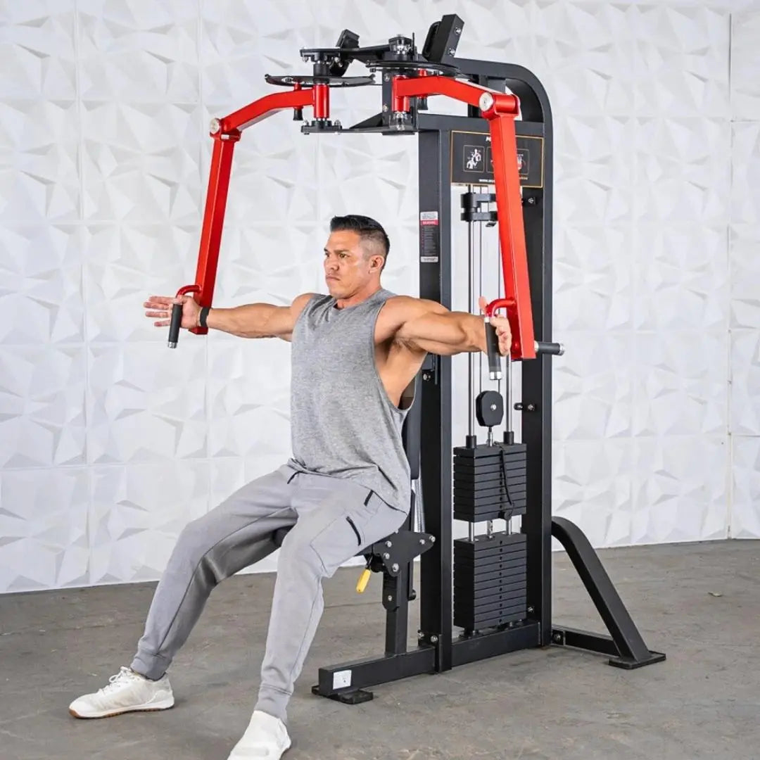 Man performing a chest fly exercise on a red and black selectorized pec and rear delt combo machine with weight stack.