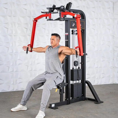 Man performing a chest fly exercise on a red and black selectorized pec and rear delt combo machine with weight stack.