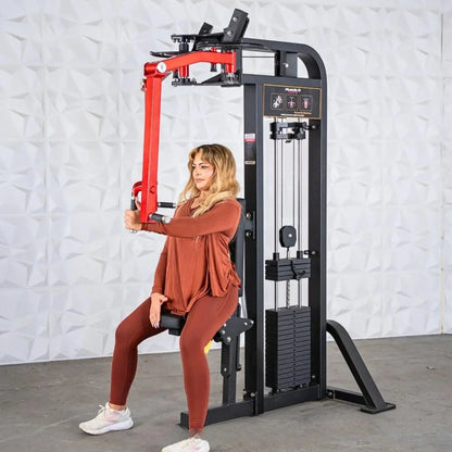Woman performing a chest exercise on a black and red selectorized pec and rear deltoid combo machine in a gym setting.