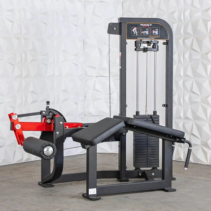 Black and red selectorized prone leg curl machine with padded seat, weight stack on right side, and instruction placard on upper frame.