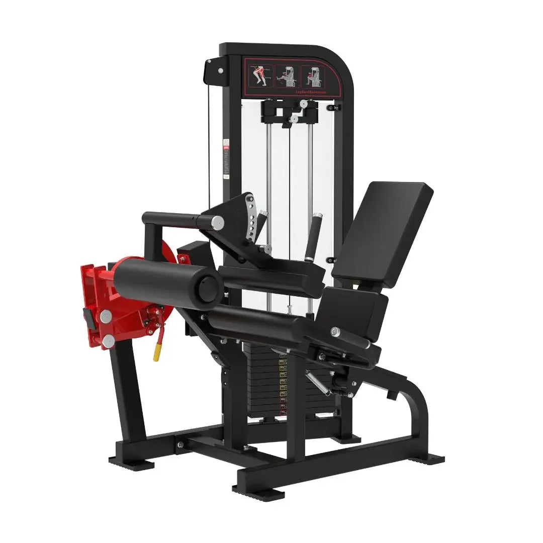Commercial seated leg curl machine with black frame, red foot platform, and padded seat. Cable-driven system with instruction graphics displayed on top panel.
