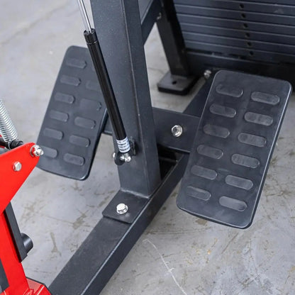 Seated row machine with black footplates featuring textured grip surface and adjustable black vertical support frame with chrome handlebar attachment.