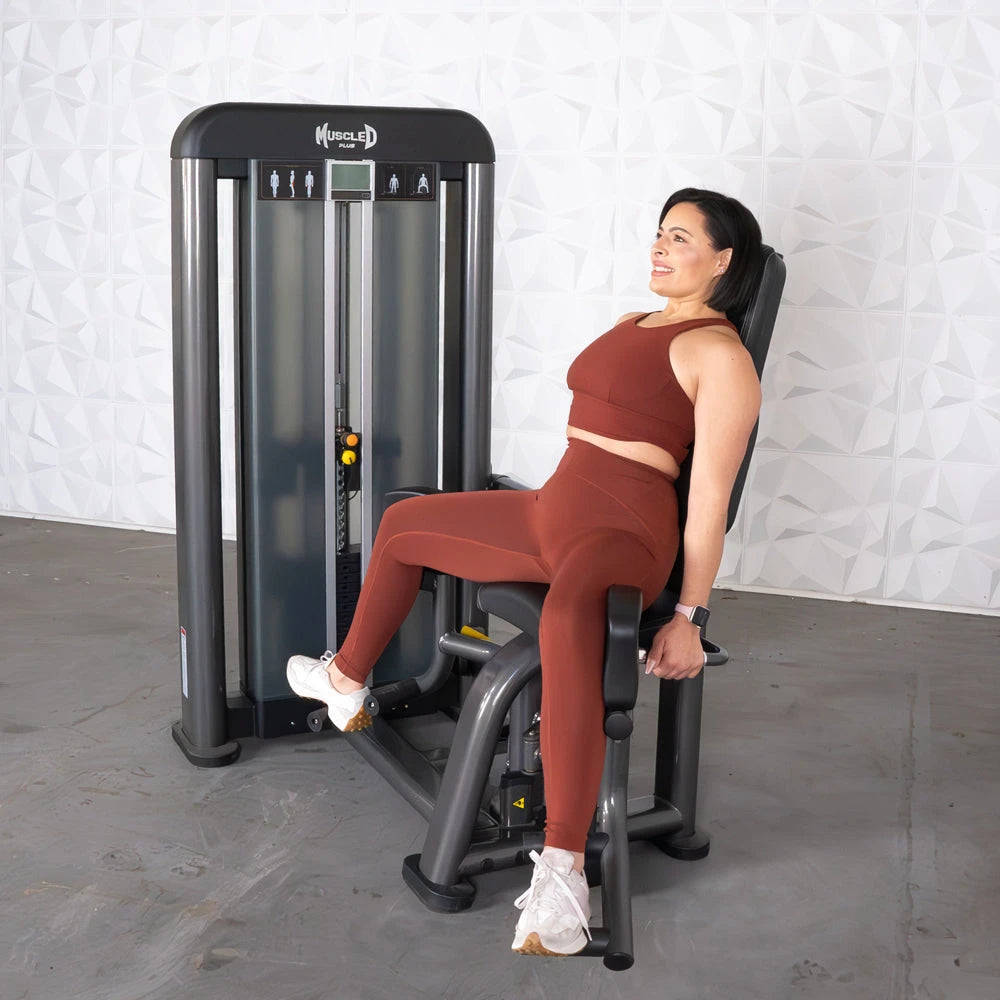 Woman using Muscle D Fitness Elite Plus Outer Thigh Machine
