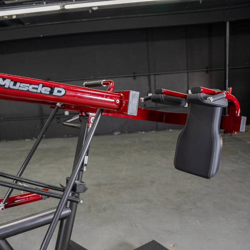 Red Power Leverage V2 Pendulum Squat Machine with padded seat and handles.