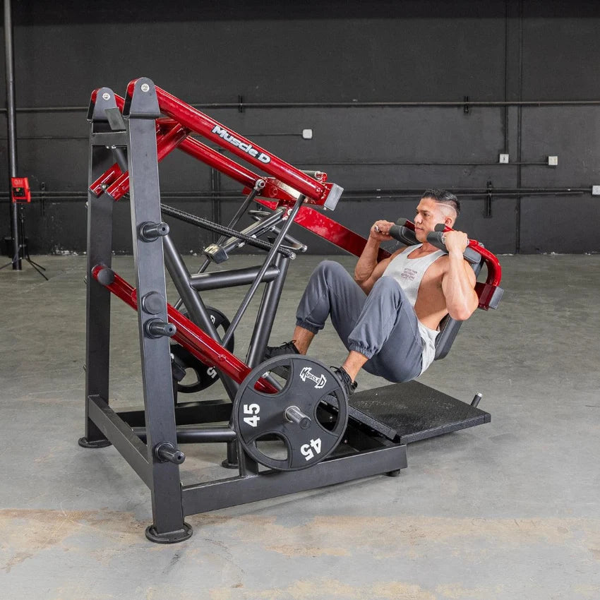 Man using red Power Leverage V2 Pendulum Squat Machine for squats