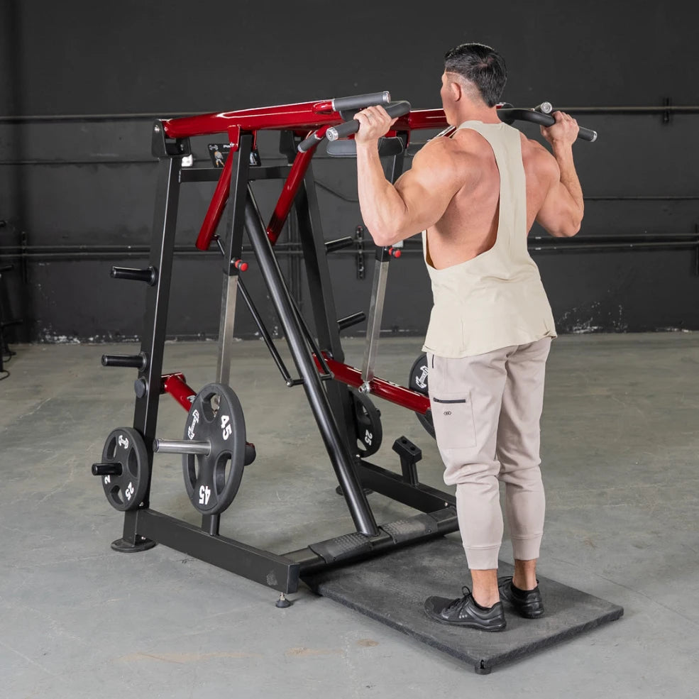 Athlete using a power-leverage Viking Press Calf Machine in the gym.
