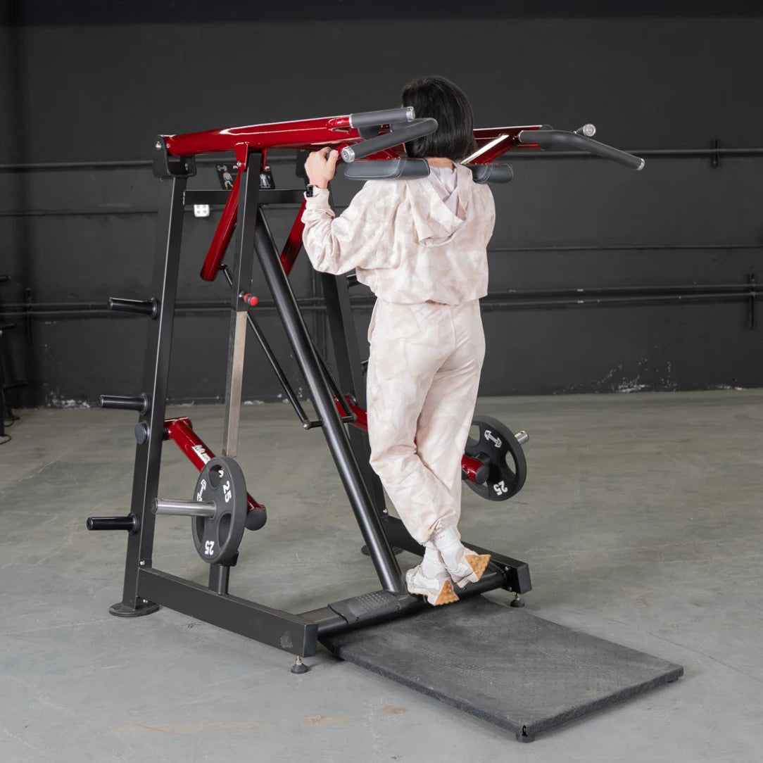 Person in protective suit using a Viking Press Calf Machine.