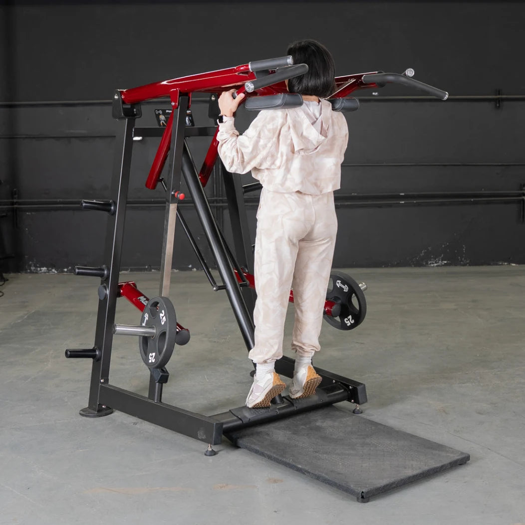 Person in light clothing using Viking Press Calf Machine with weights