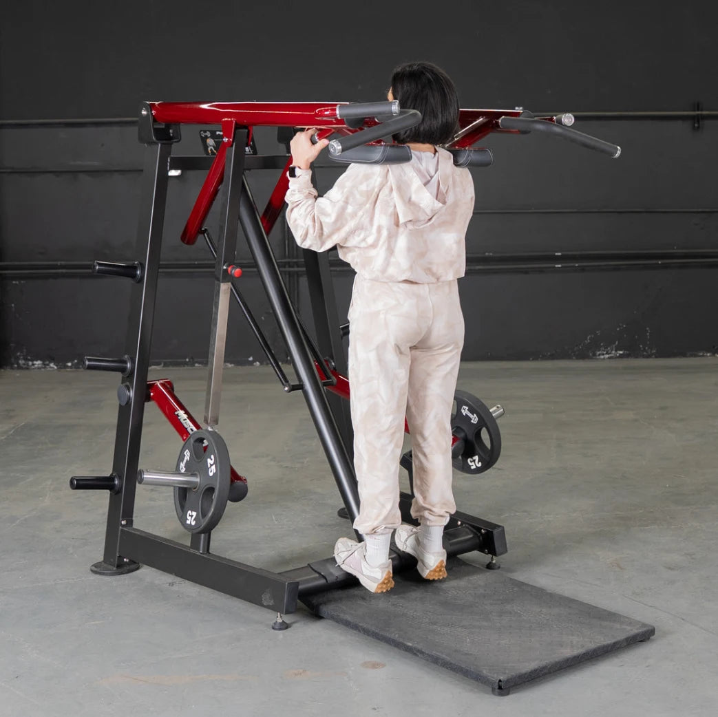 Person using Power Leverage Viking Press Calf Machine in gym.