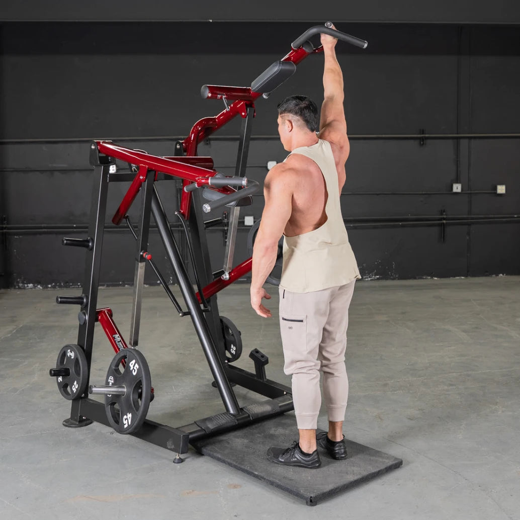 Man using a red Power Leverage Viking Press Calf Machine in gym.