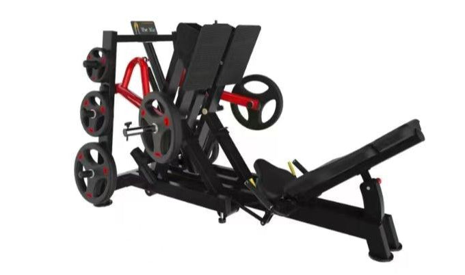 Plate-loaded leg extension/press machine with adjustable bench and weight plates.