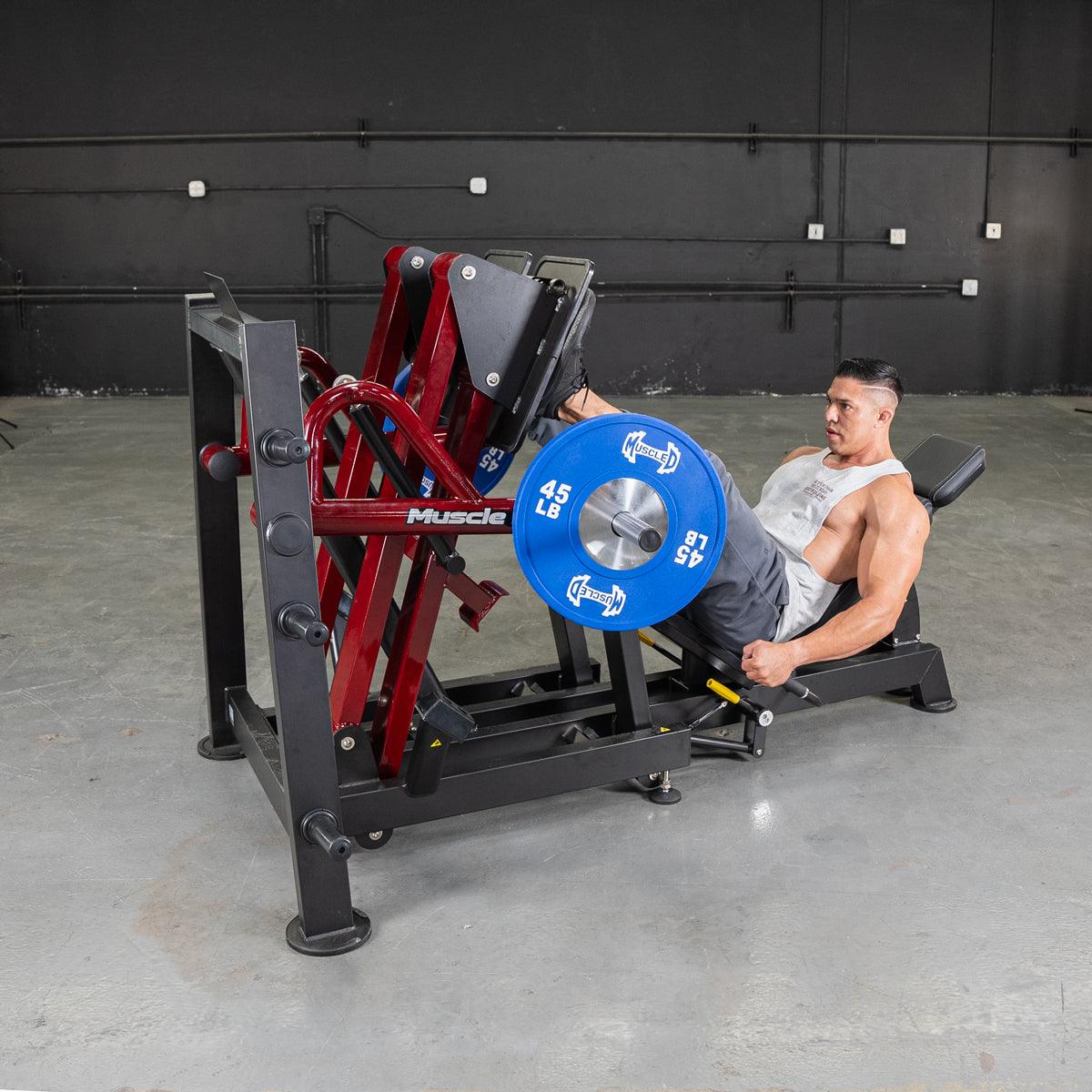 Man performing leg press on 45-degree iso-lateral press machine.