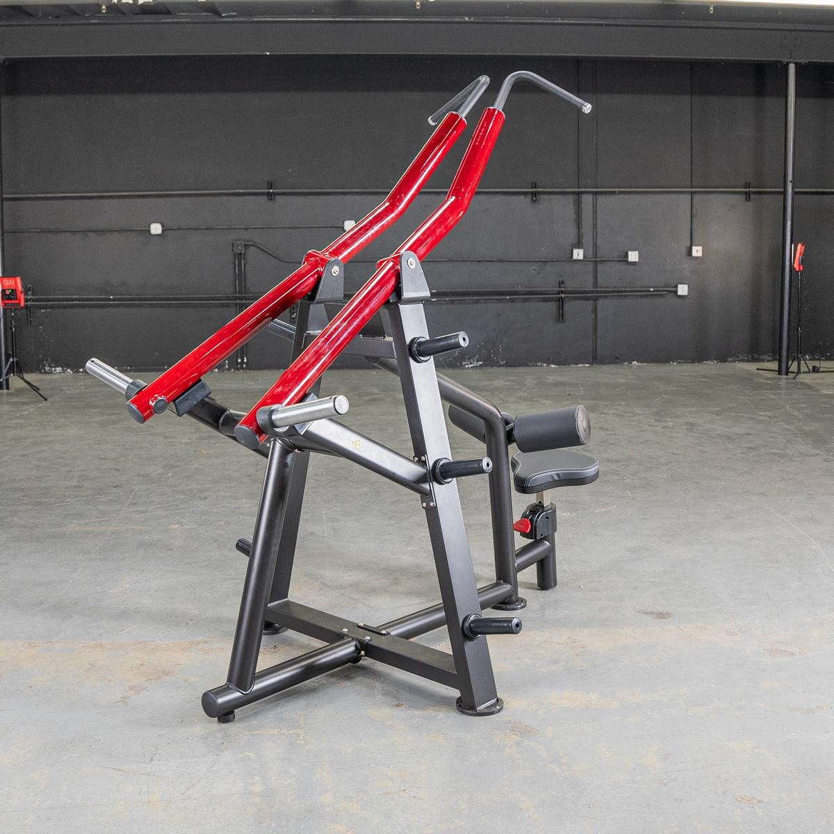 Red and black gym equipment for back exercises with ergonomic handles.