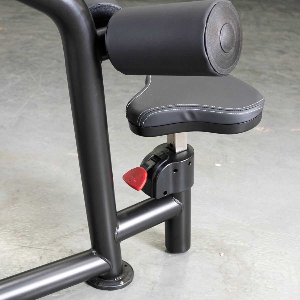 Adjustable black gym equipment seat with red lever and cushioned support.
