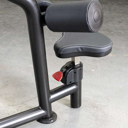 Adjustable black gym equipment seat with red lever and cushioned support.