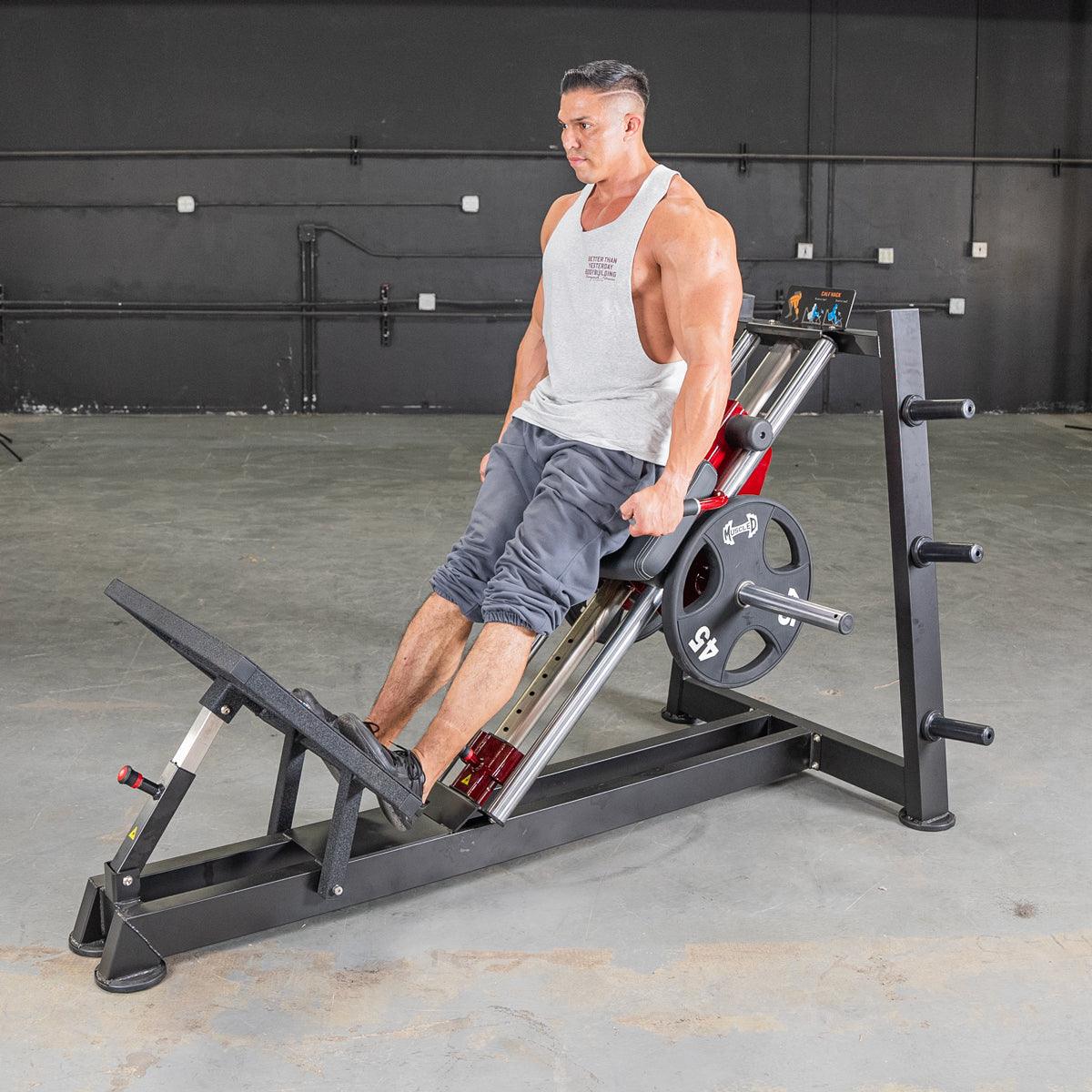 Man in gym using Power Leverage V2 Hack Squat Calf Raise machine.