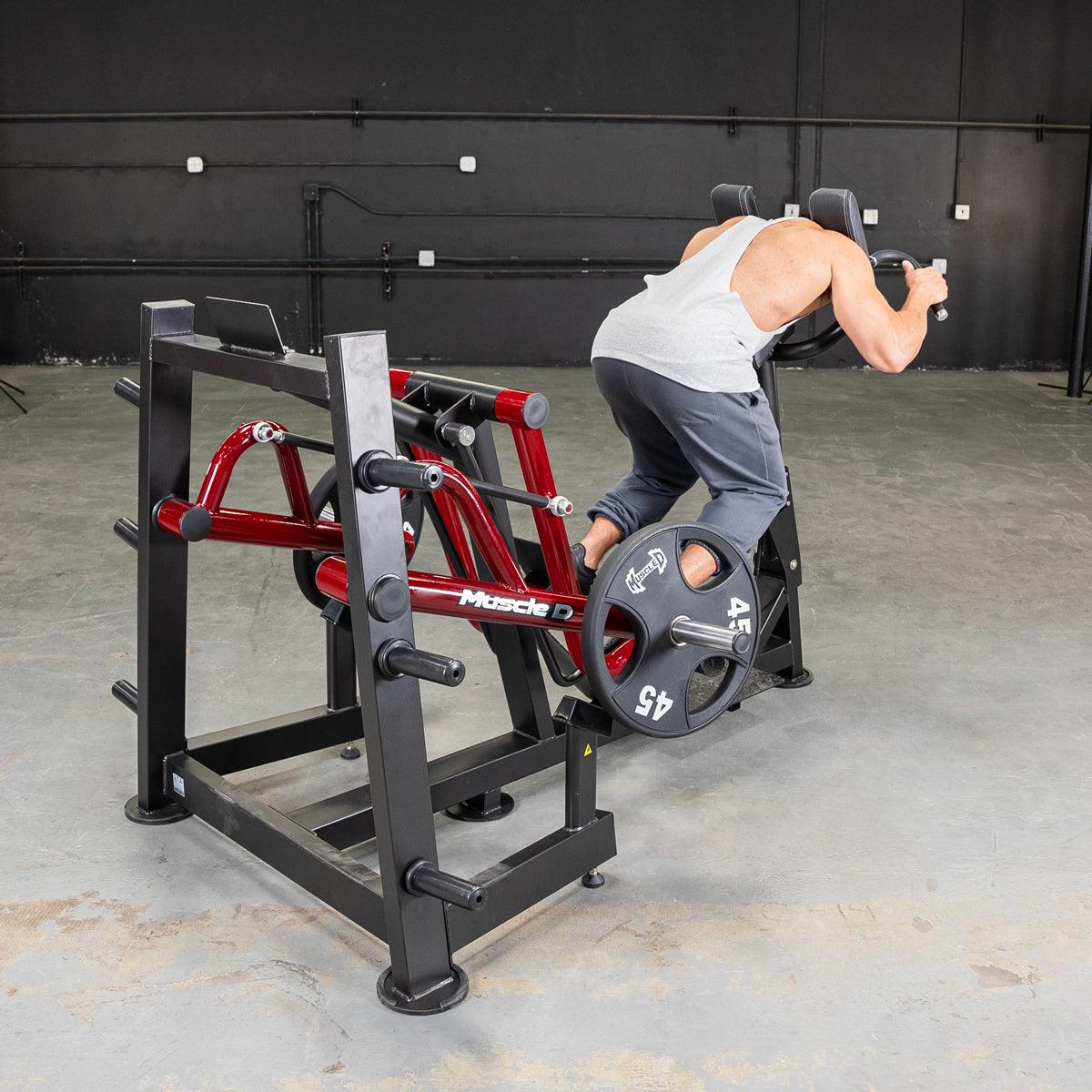 Person using Power-Leverage V2 Iso-Lateral Sprint Trainer in a gym.