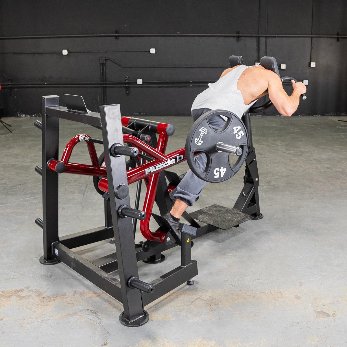 Person using Power Leverage V2 iso-lateral sprint trainer machine in gym.