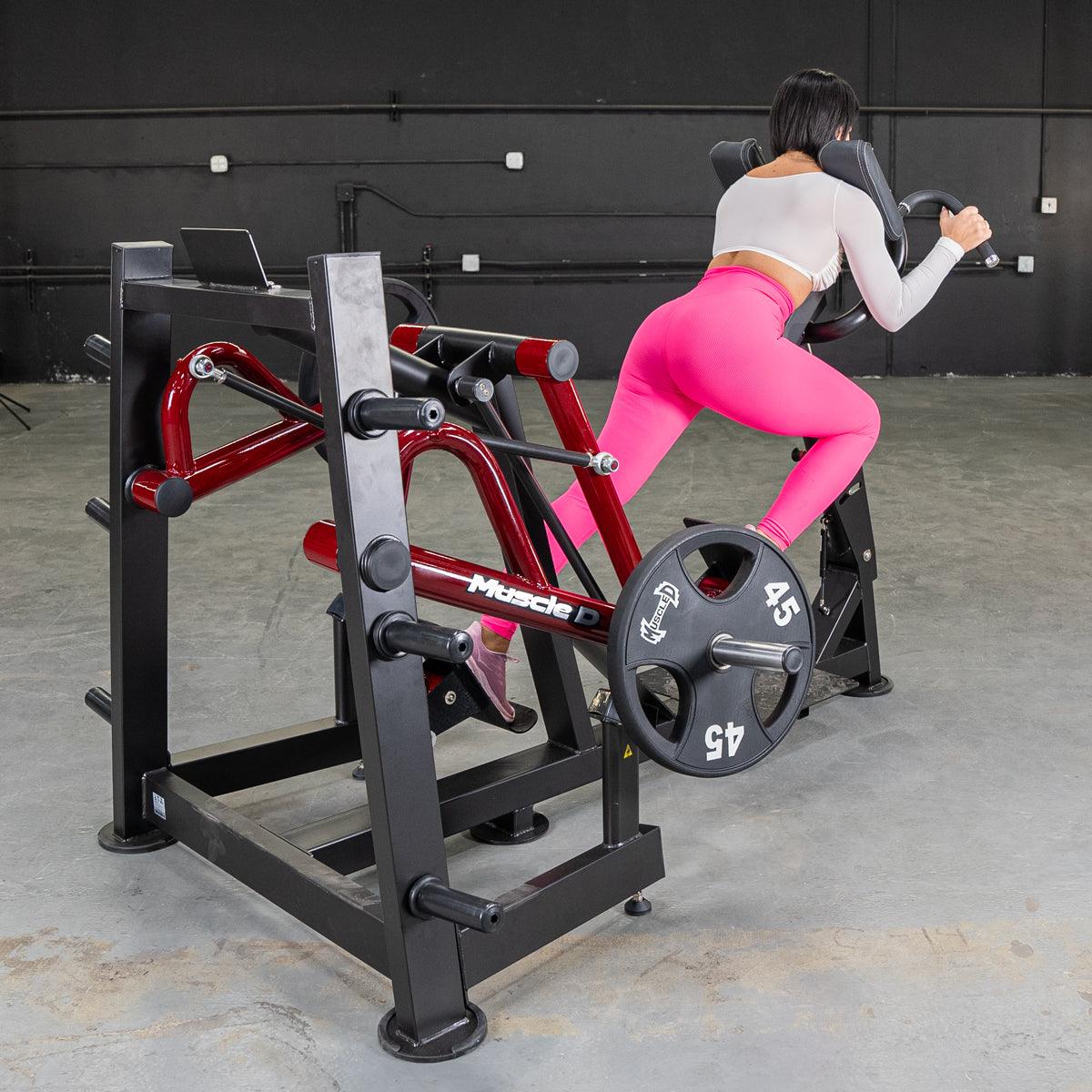 Woman using a Power Leverage Iso-Lateral Sprint Trainer machine in a gym.
