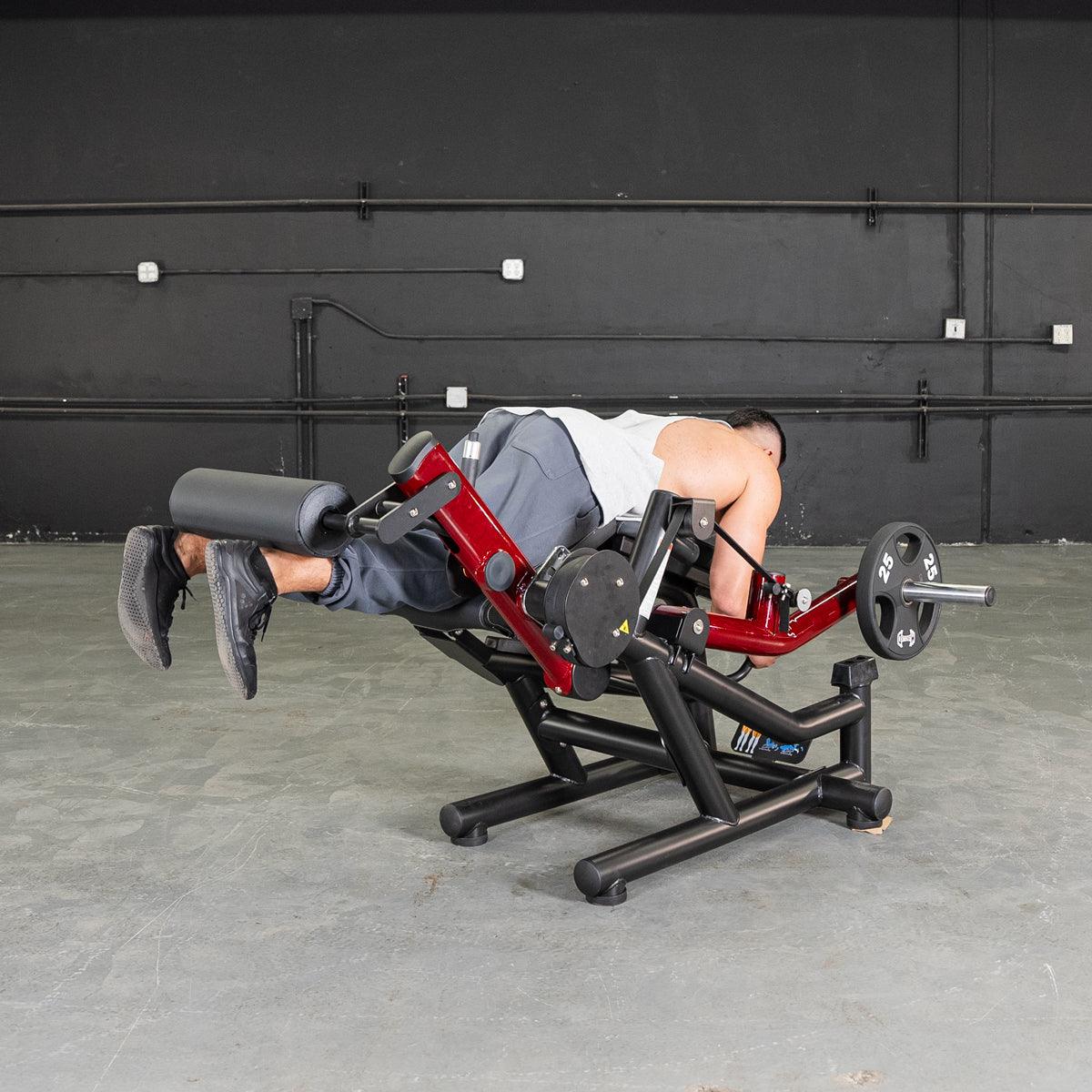 Person using Power Leverage V2 leg extension/prone leg curl machine.