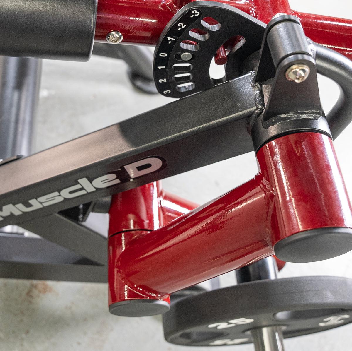 PowerLeverage V2 Prone Leg Curl machine close-up lever and red frame.