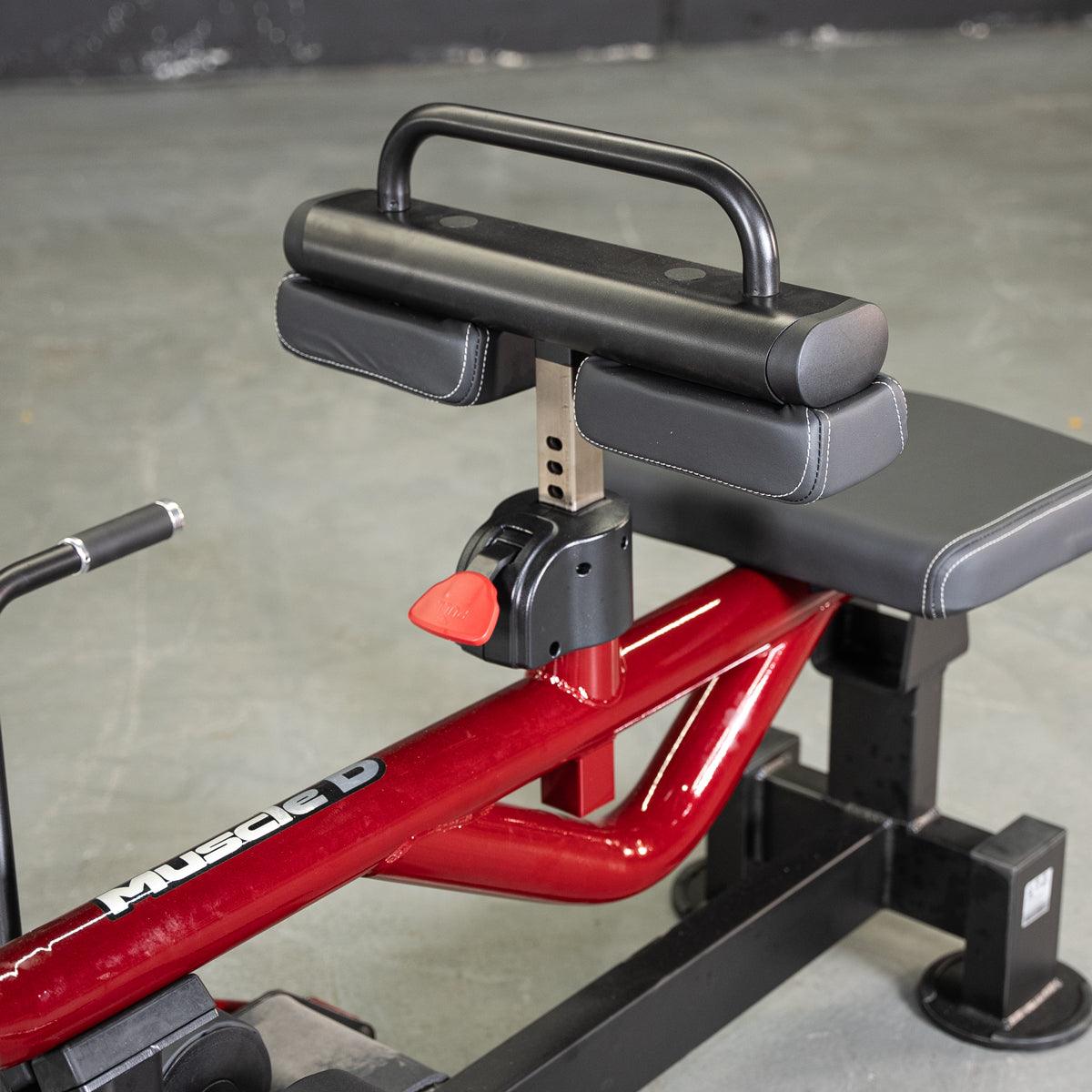 Power Leverage V2 Seated Calf/Tib machine with padded pads on a red frame.