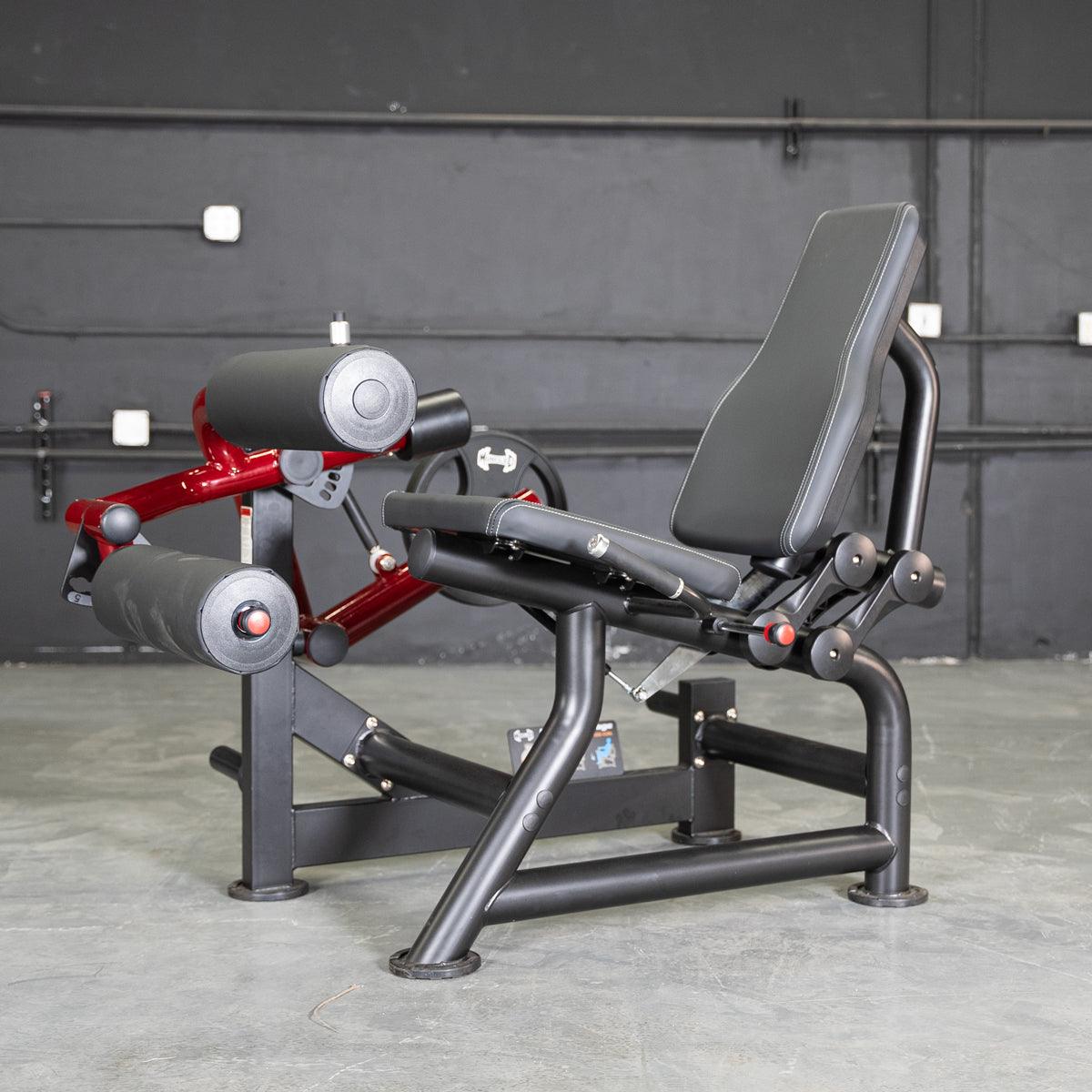 Power Leverage seated leg curl machine with padded supports.