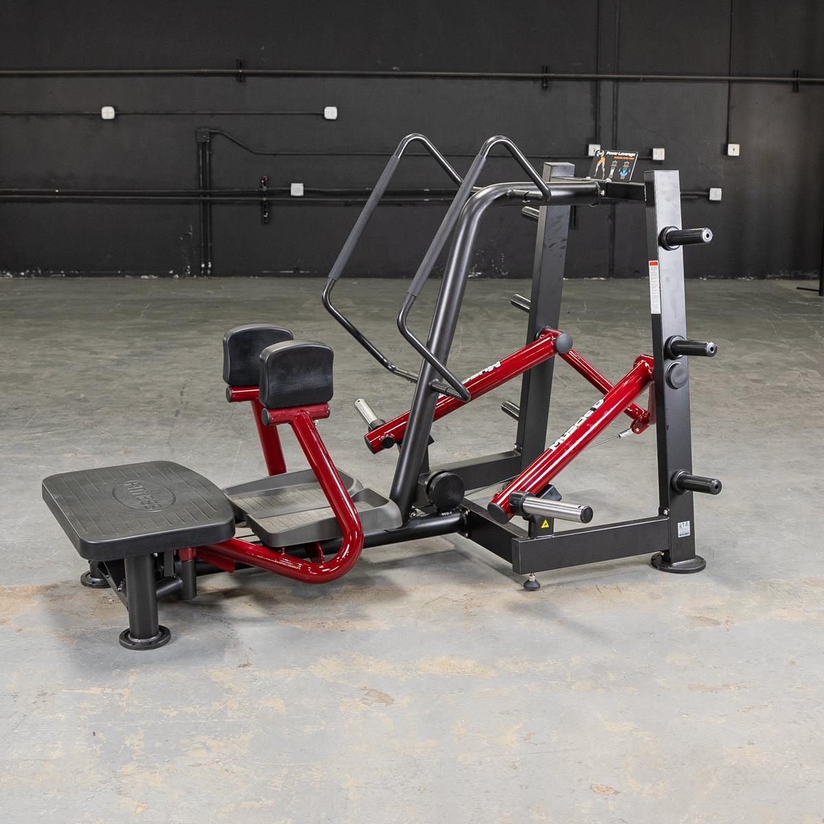 Power-Leverage V2 standing abductor machine with red frame in gym.