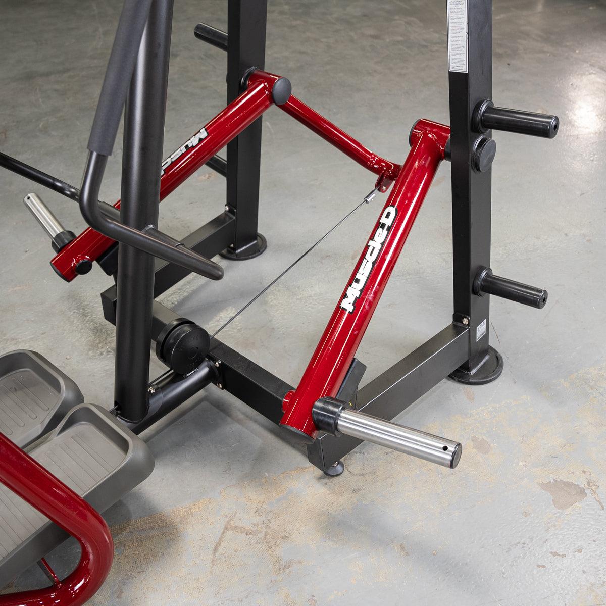 Red PowerLeverage V2 standing abductor machine attached to a squat rack.