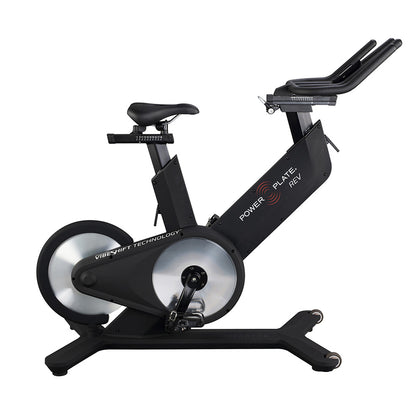 Power Plate REV exercise bike featuring VibeShift technology, designed for indoor cycling workouts, with a sleek black frame and adjustable seat.