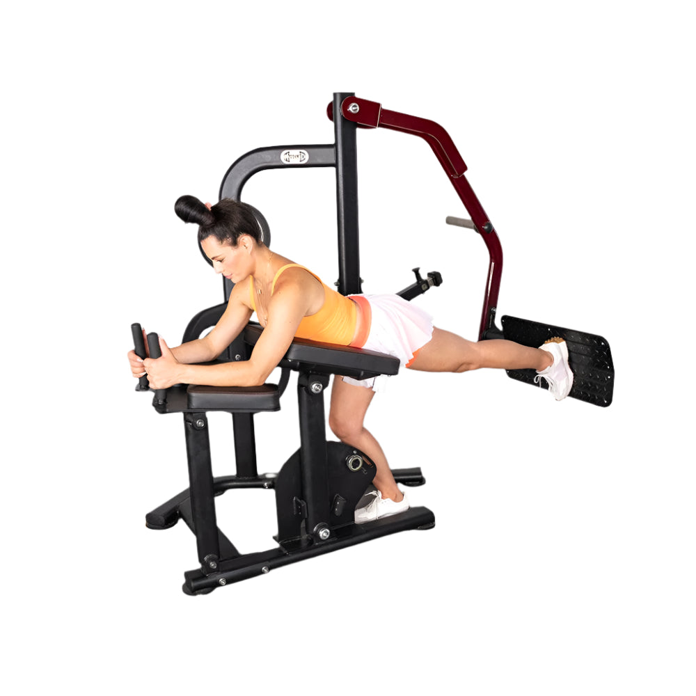 Person using Pro-Strength Booty Shaper gym machine for glutes.