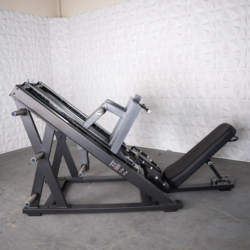 ProStrength dual leg press machine with black metal frame and angled sled.