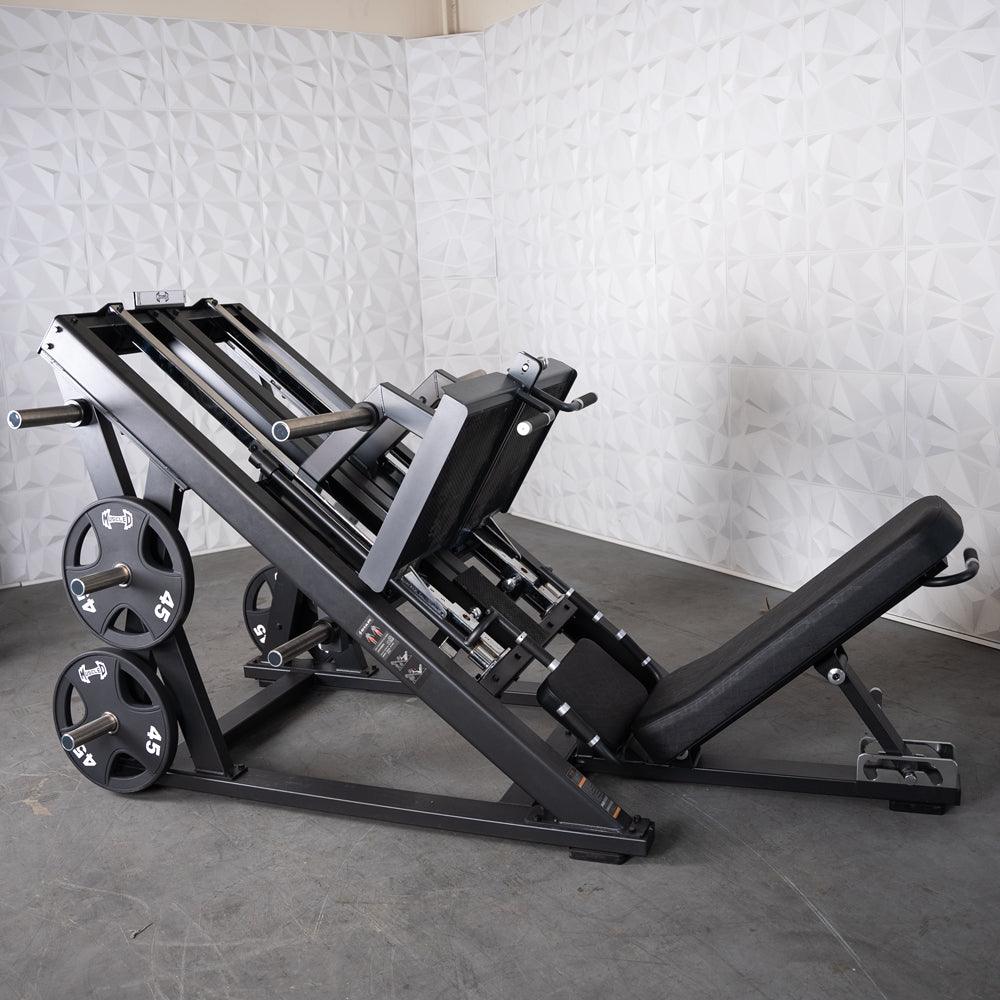 ProStrength dual leg press machine with weight plates.