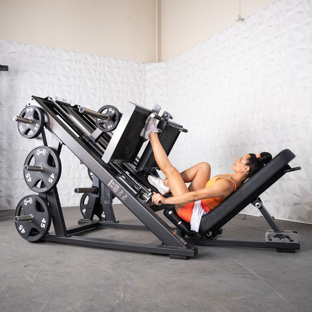 Woman exercising on a ProStrength dual leg press machine.