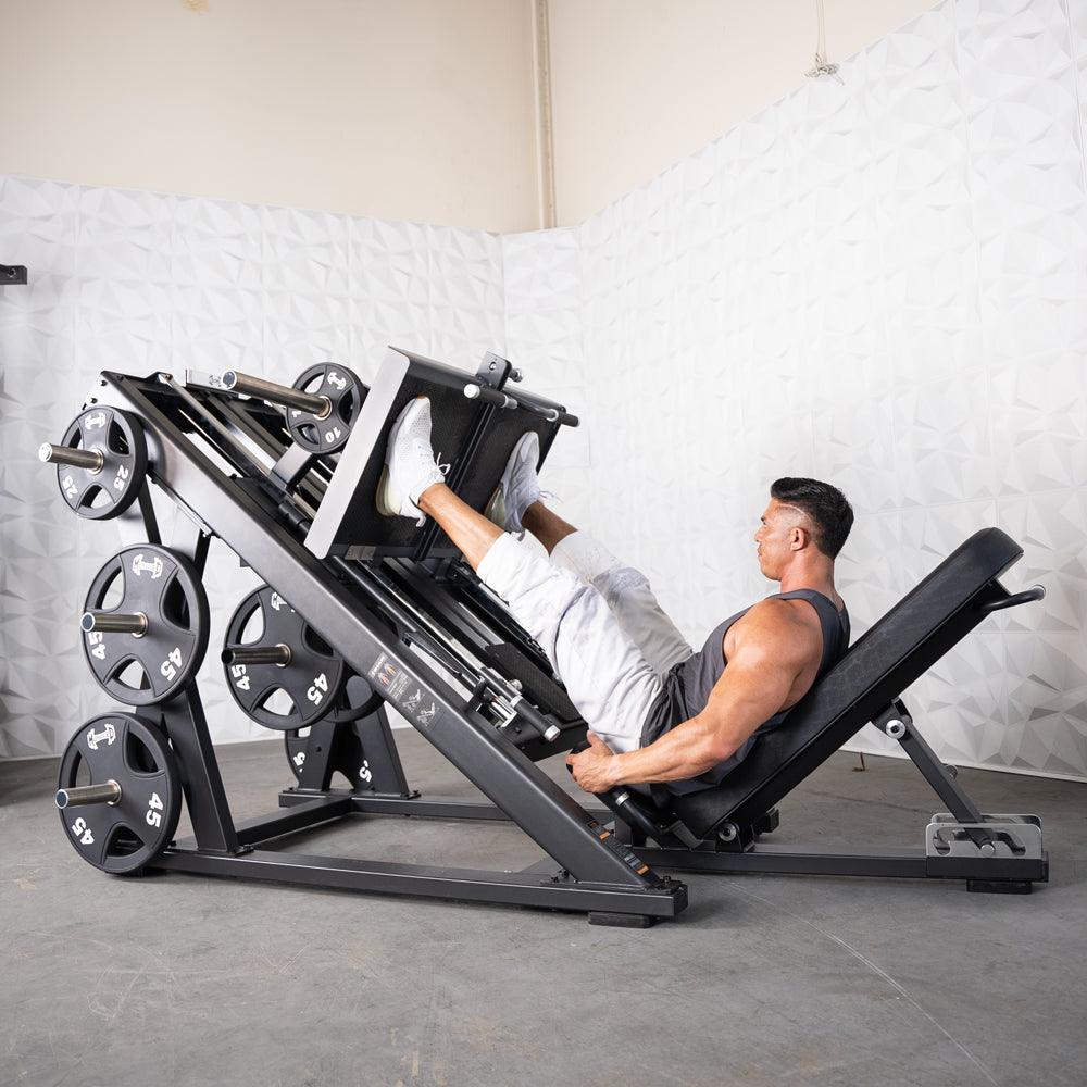 Man using a ProStrength dual leg press machine in gym