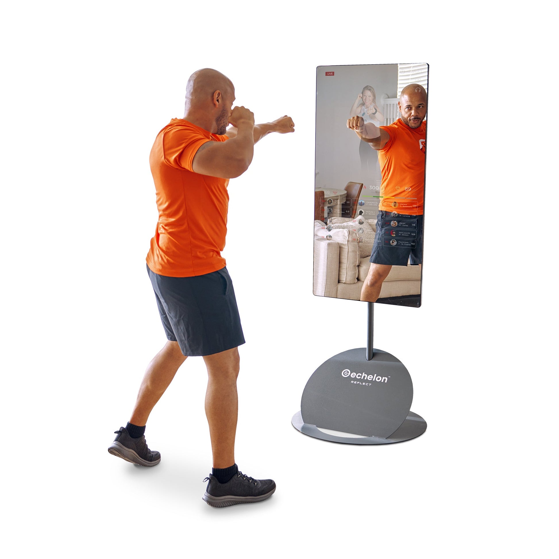 A person in an orange shirt performing a punching exercise in front of the Echelon Reflect 50\ Smart Fitness Mirror, showcasing an interactive workout environment.
