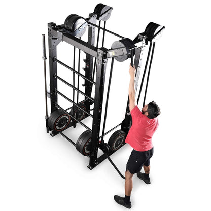 Man adjusts InertiaWave workout equipment with resistance bands.