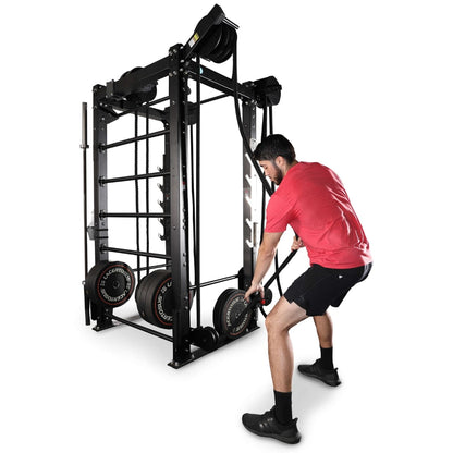 Man using black functional trainer with resistance bands for strength workout.